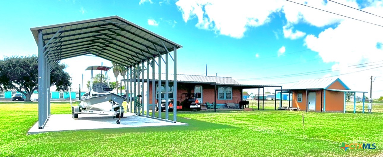 a view of an house with backyard porch and sitting area