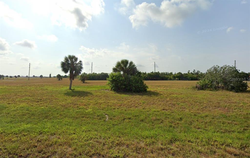 a view of a lake with a big yard