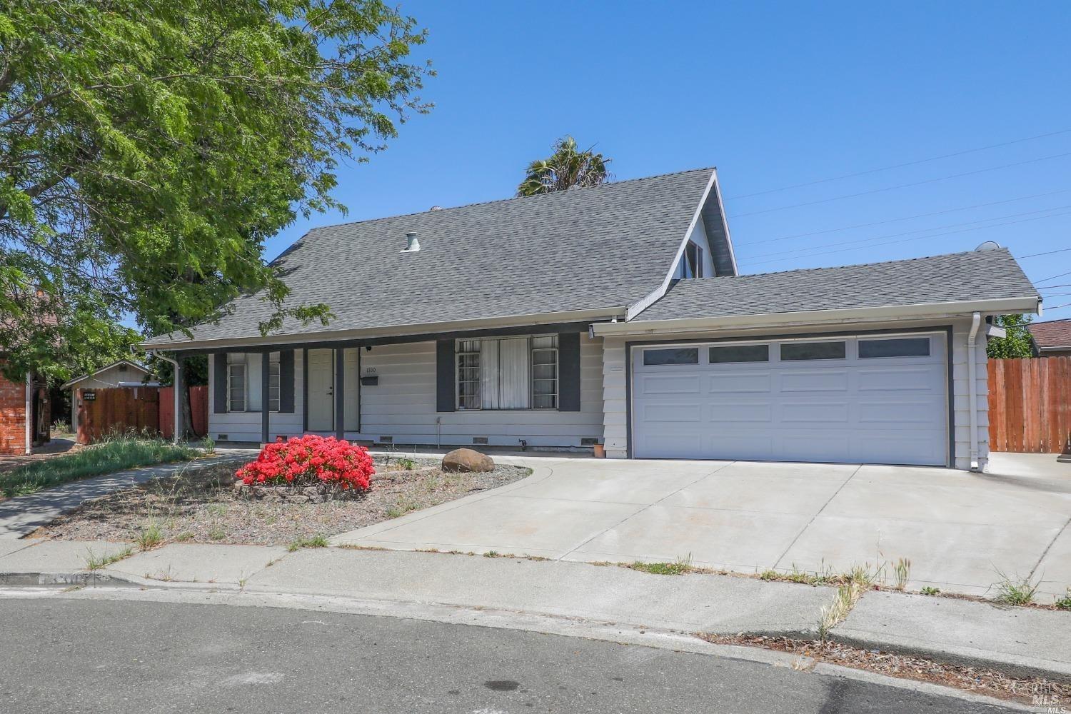 a front view of a house with a garage