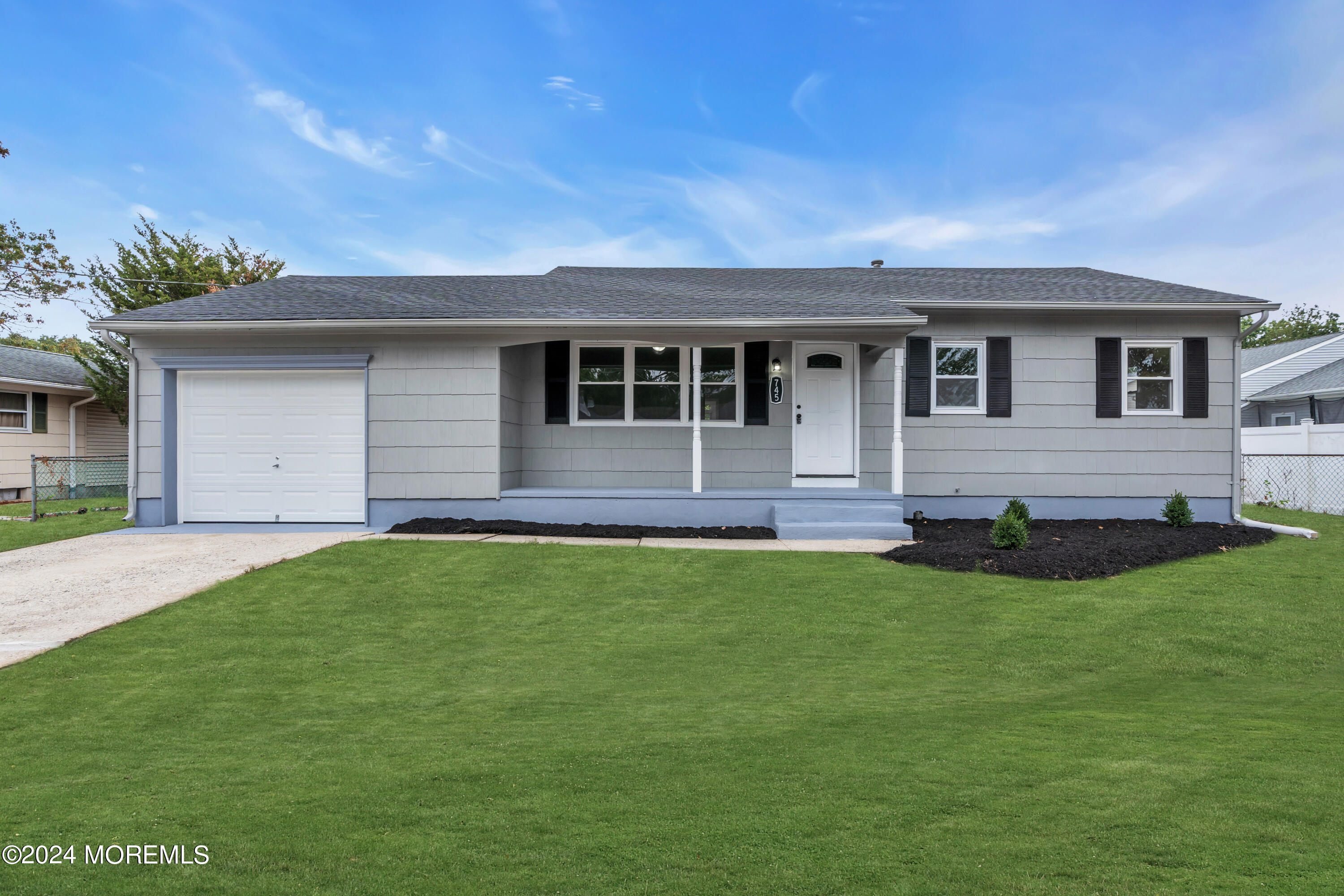 a front view of a house with yard