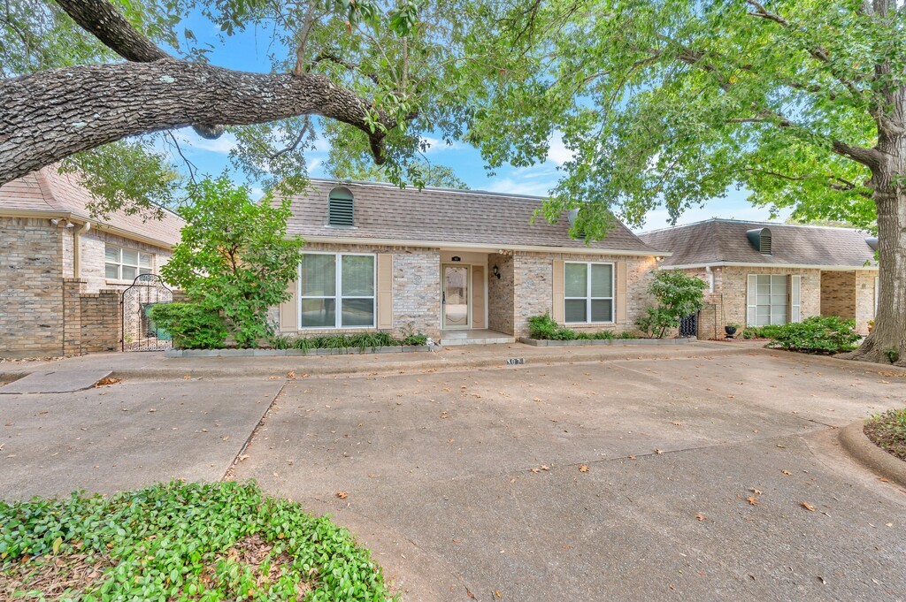 front view of a house next to a road