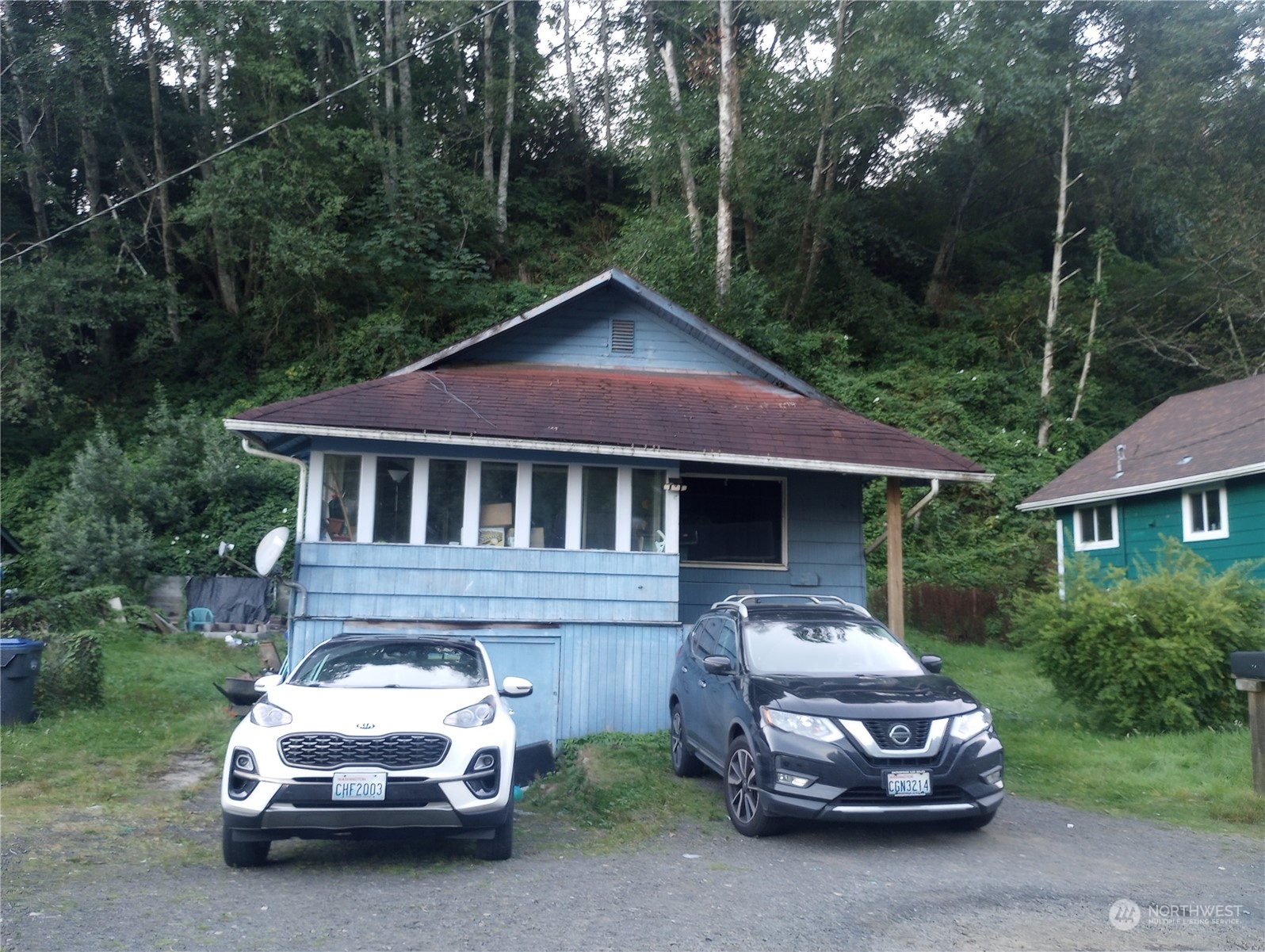 a car parked in front of a house