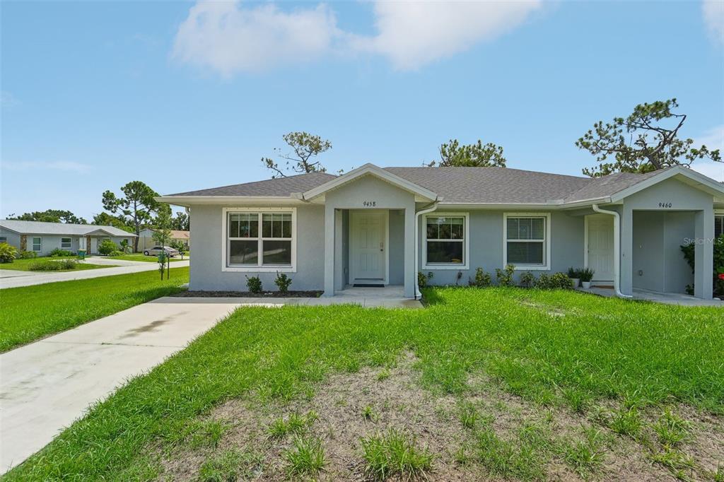 front view of a house with a yard