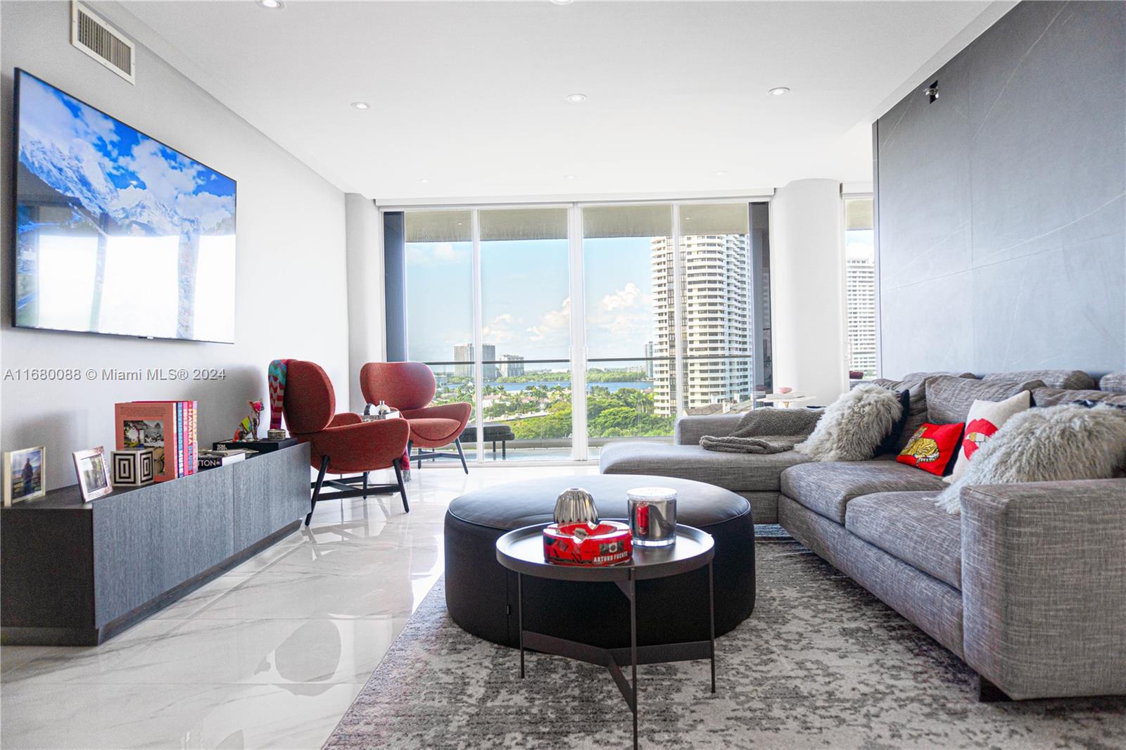 a living room with furniture and a large window