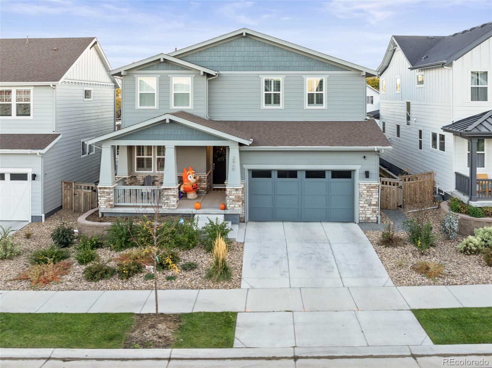 a front view of a house with garage