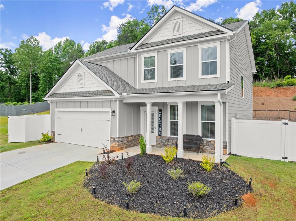 a front view of a house with a yard