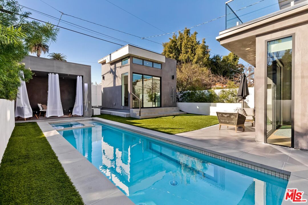 a view of a house with swimming pool