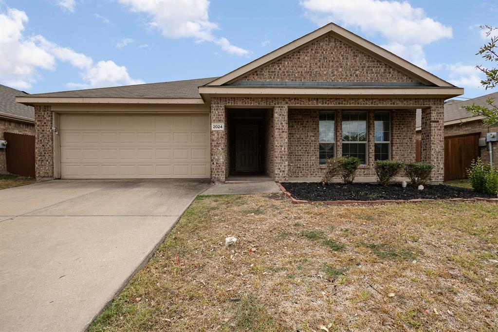 a front view of a house with yard