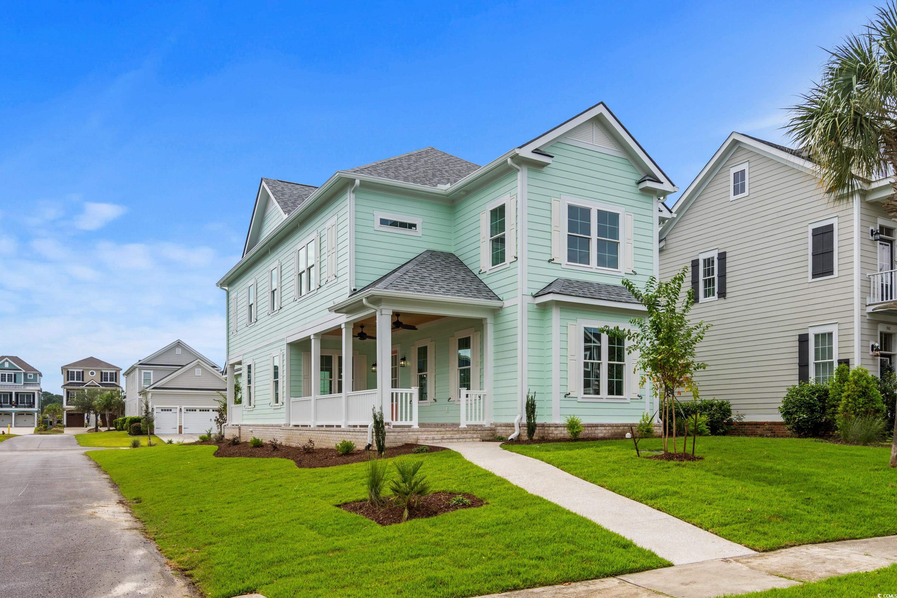 View of front of home with covered porch, a front