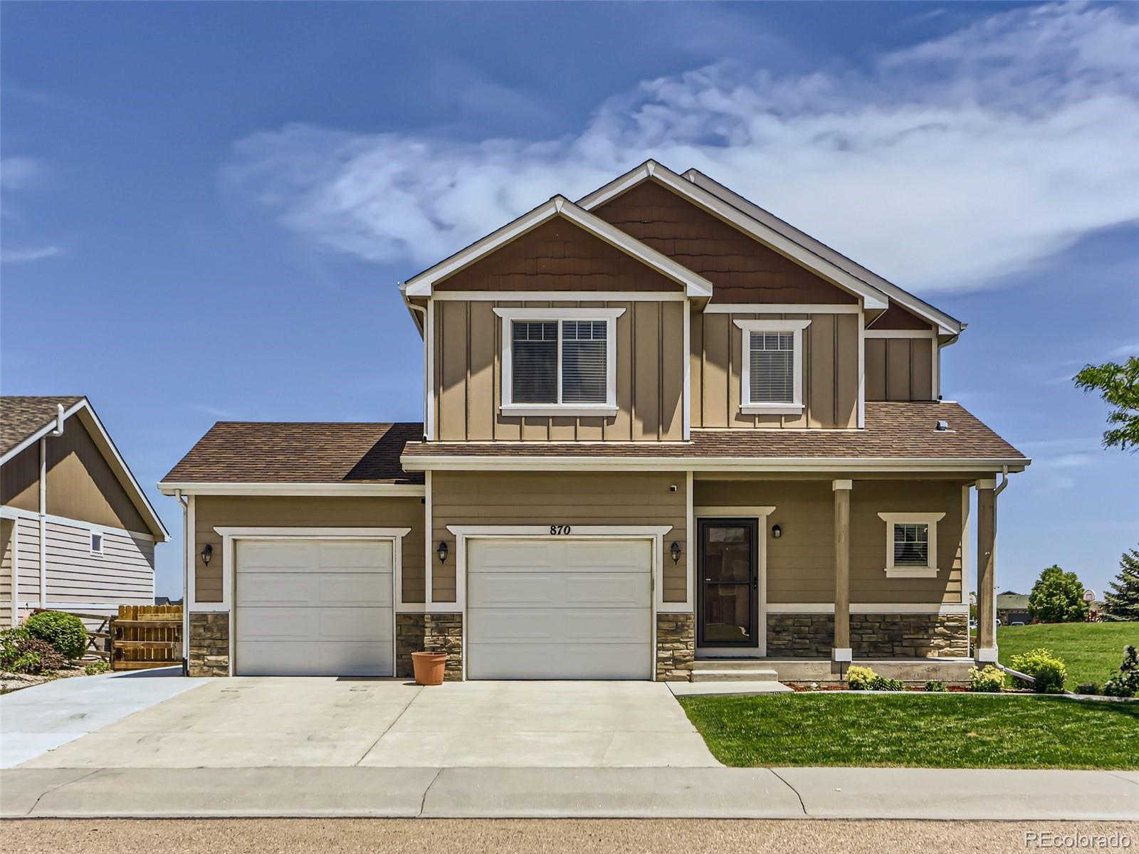 a front view of a house with yard