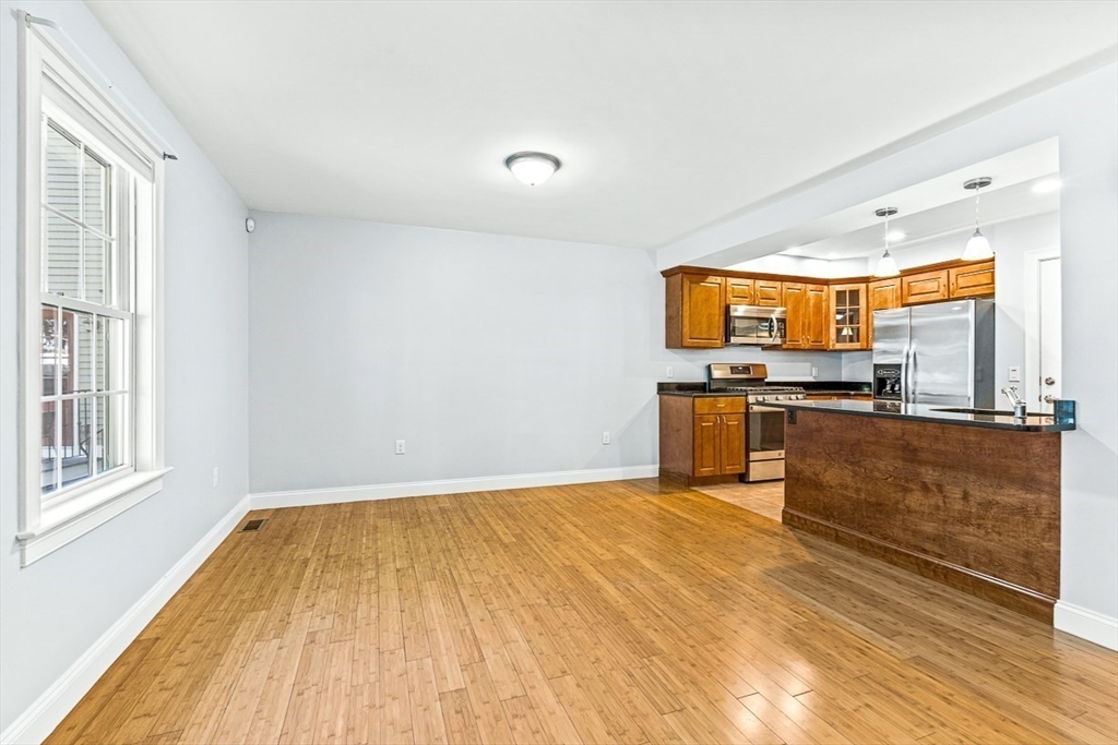 a view of kitchen with wooden floor