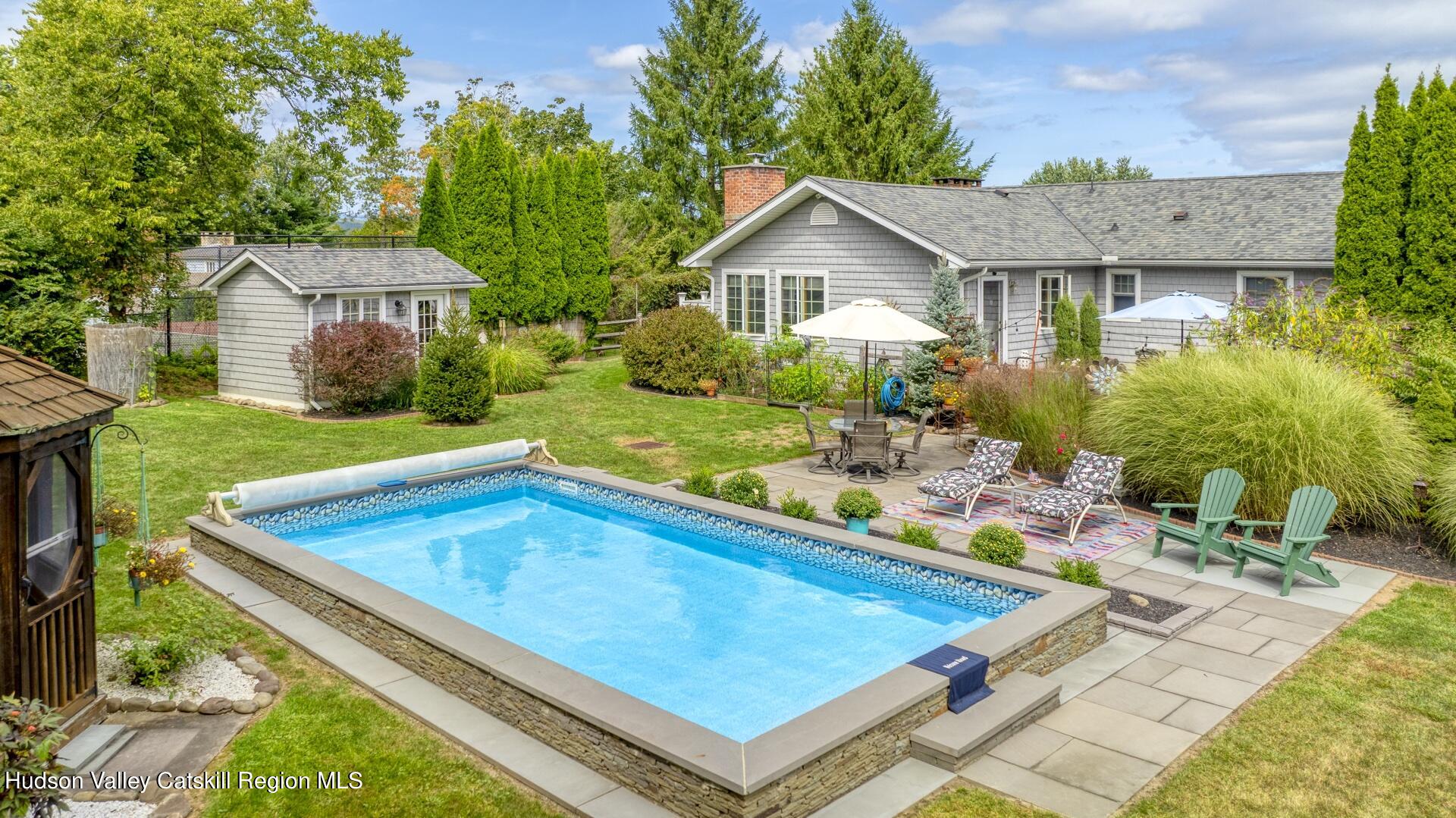 a view of a backyard with a patio and plants