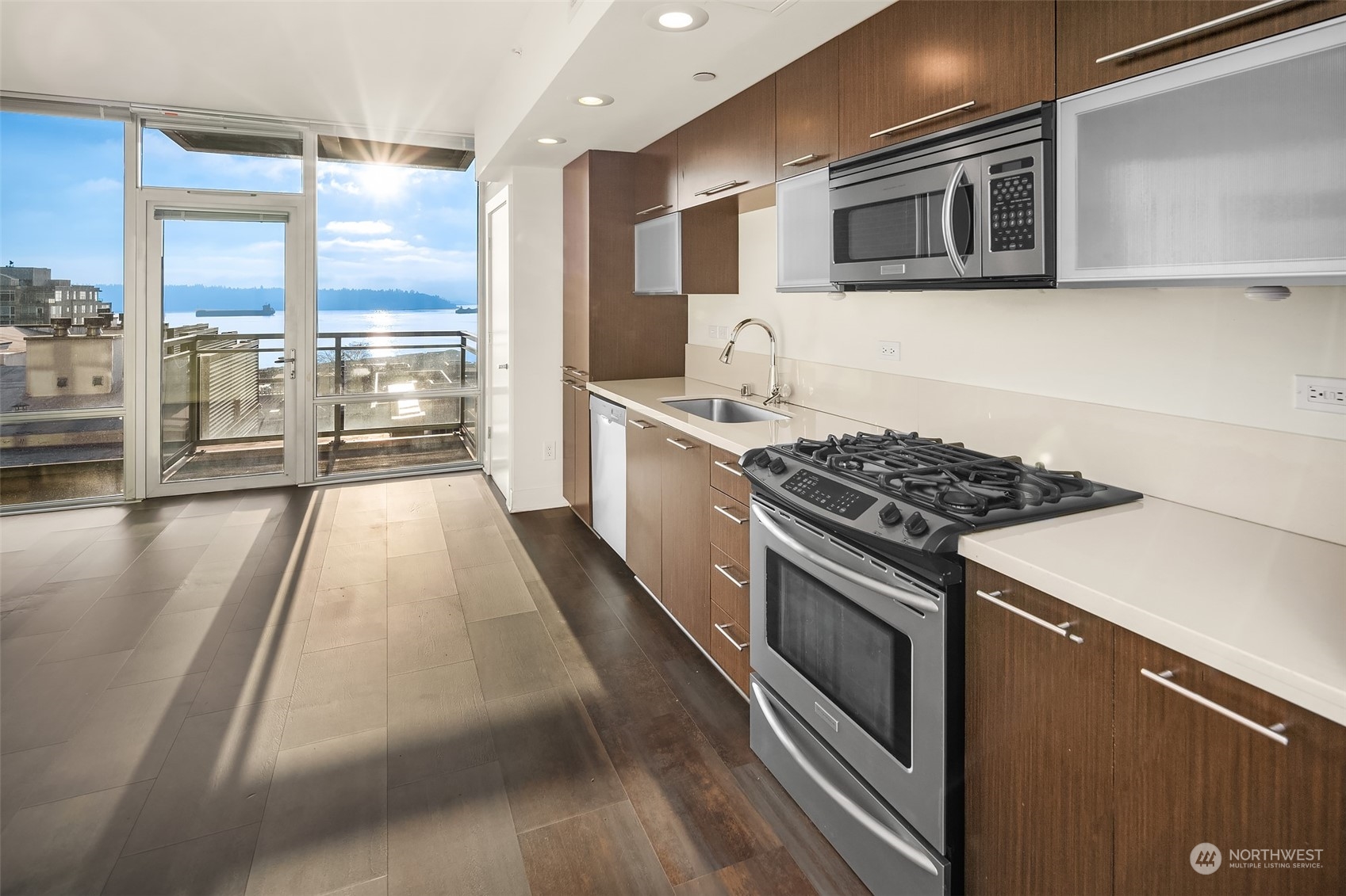 a kitchen with stainless steel appliances granite countertop a stove and a sink