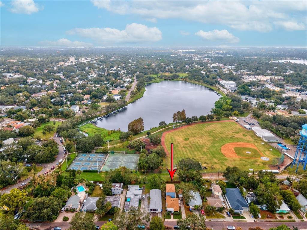 an aerial view of residential houses with outdoor space