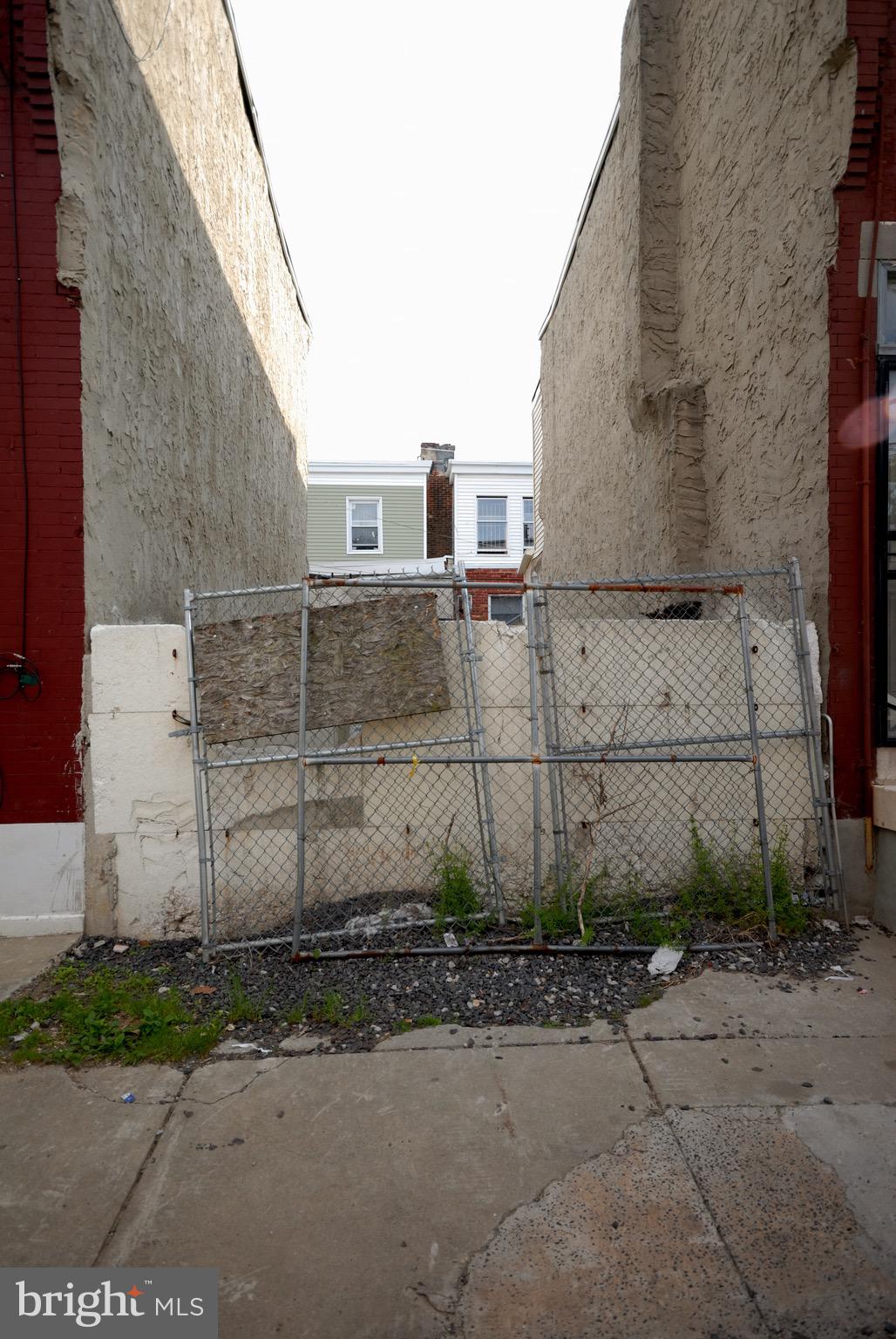 a view of a brick house with a street