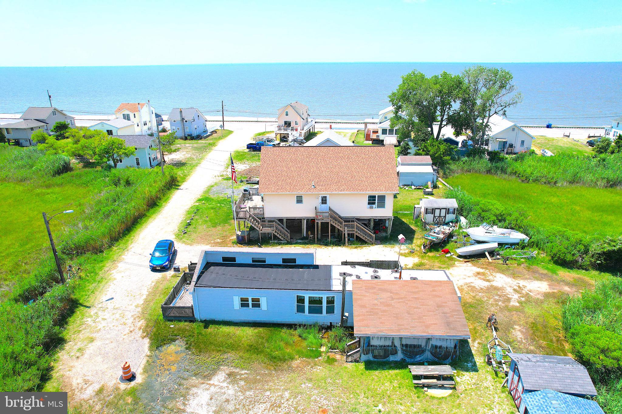 an aerial view of a house with yard swimming pool and outdoor seating