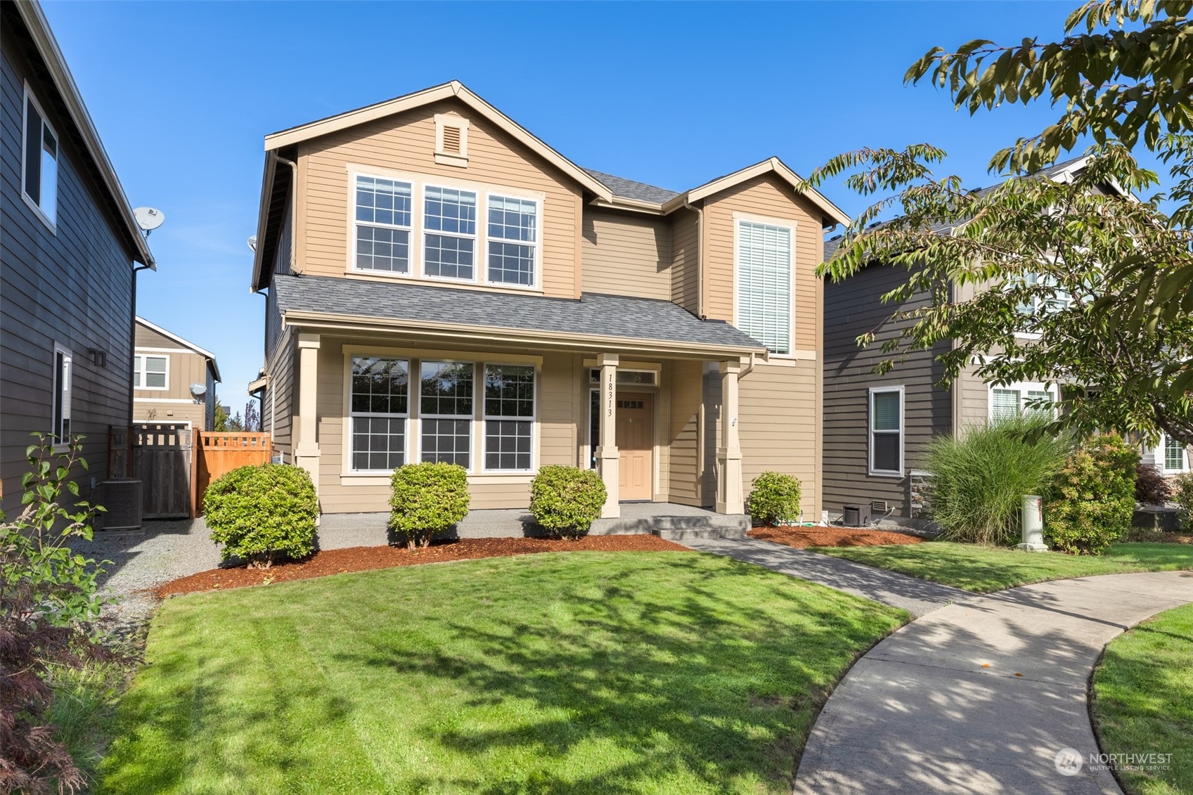 front view of a house that has a yard