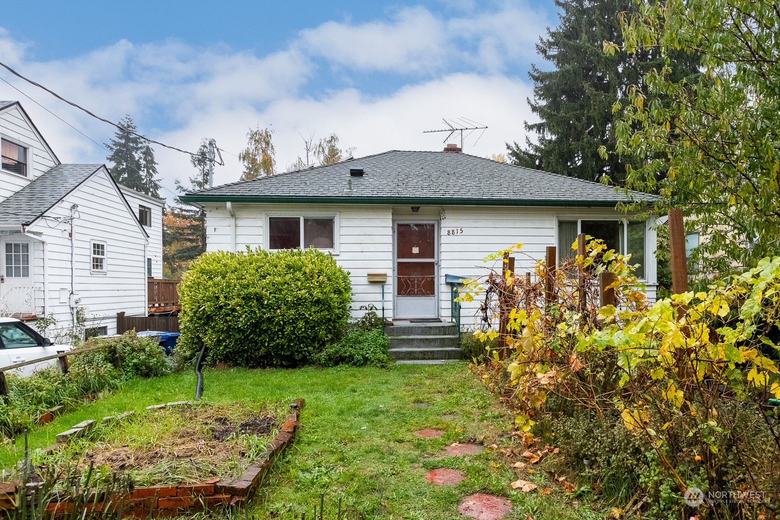 a front view of a house with garden