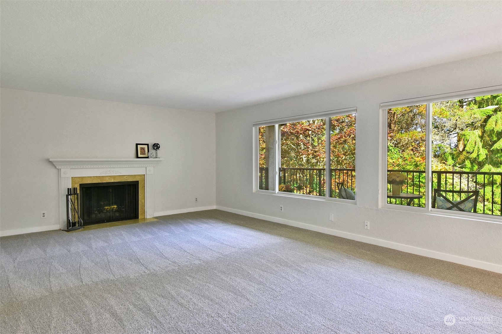 wooden floor fireplace and windows in a room