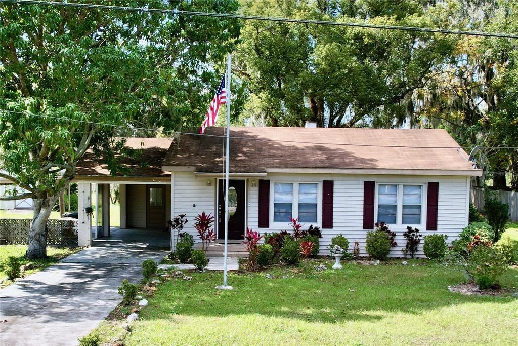 front view of a house with a yard