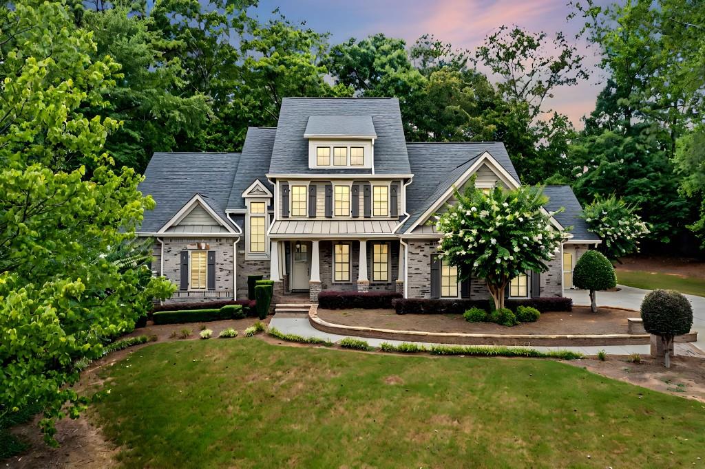 a front view of a house with garden