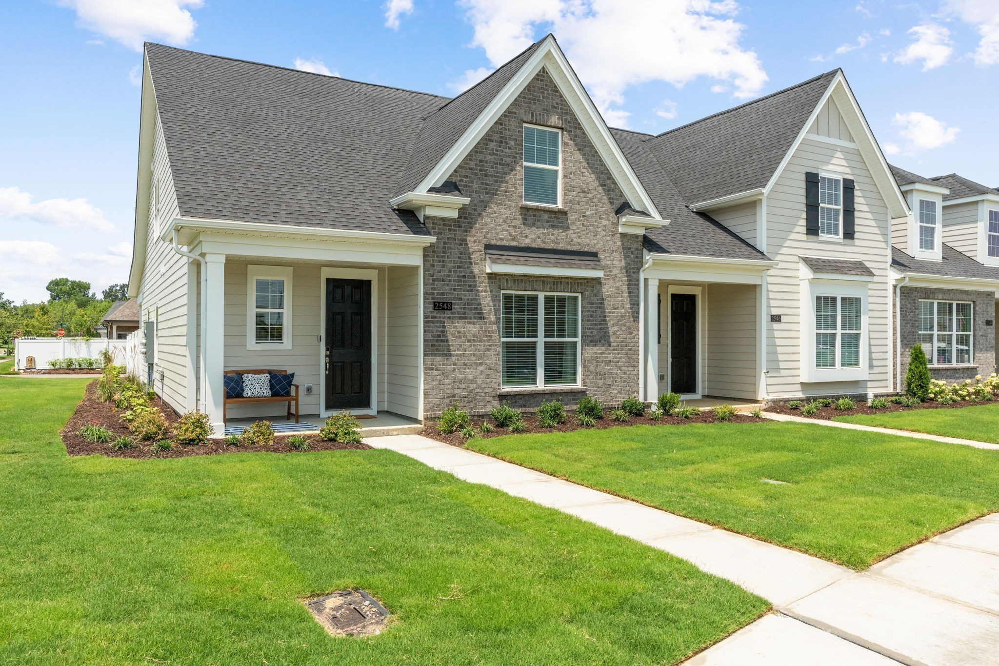 a front view of a house with a yard