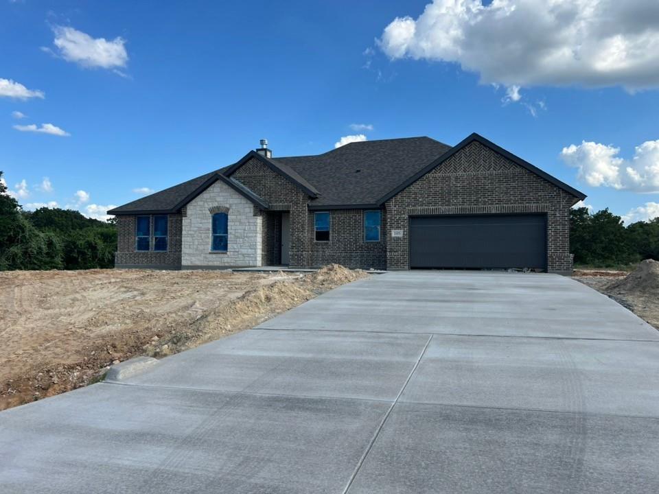 a view of house with backyard space and garden