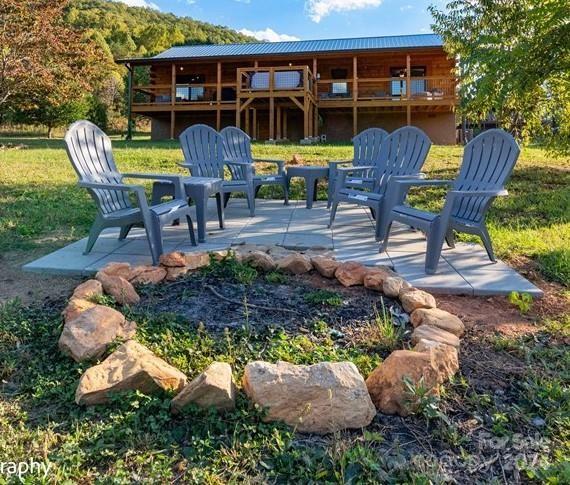 a view of a chair and table in backyard