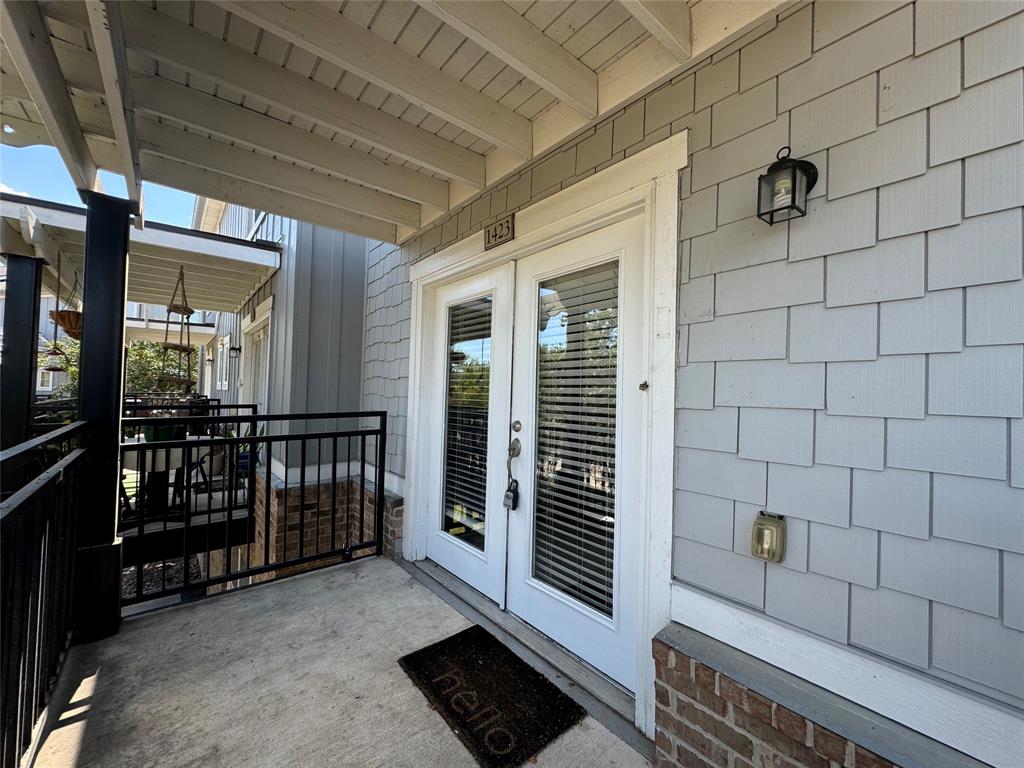 a view of a porch with wooden floor