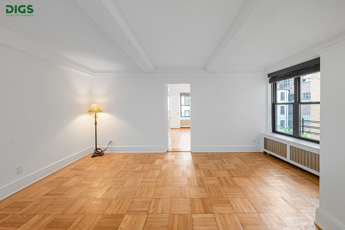 a view of an empty room with a window