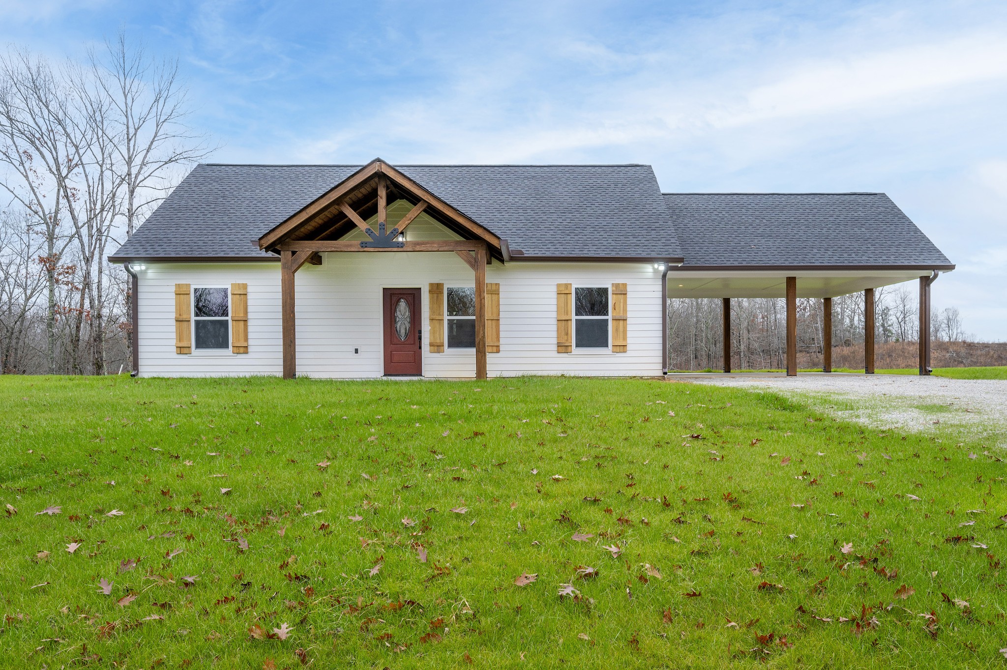 a front view of house with yard and green space