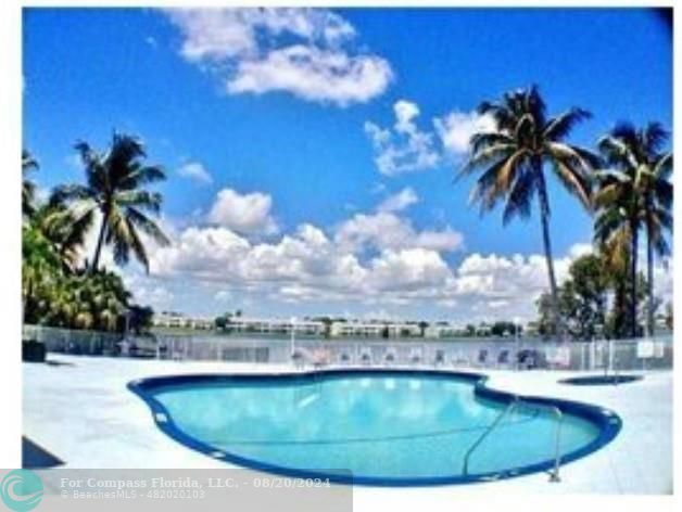 a view of a swimming pool with a garden