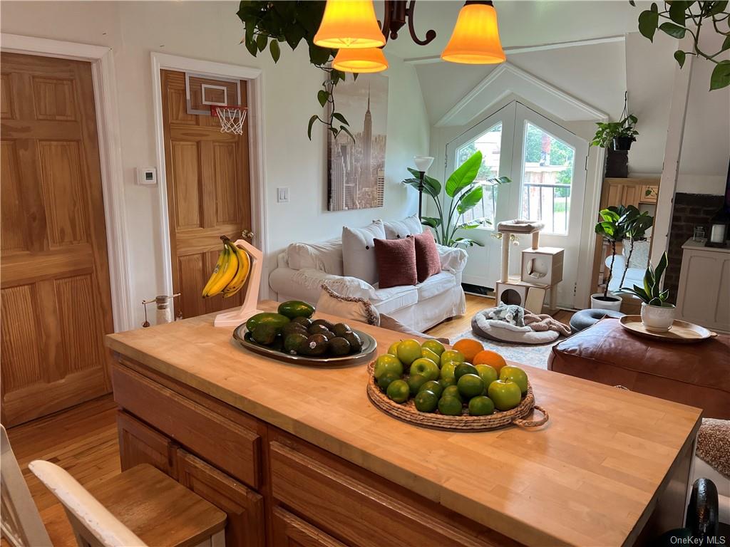 a room with furniture and a potted plant