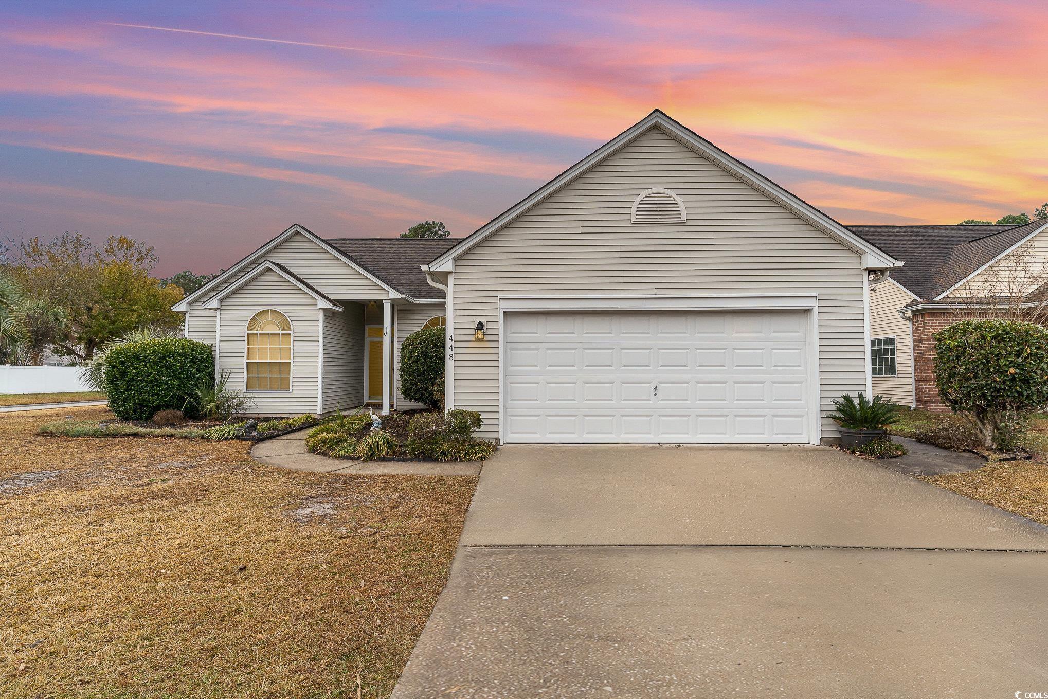 Single story home with a garage