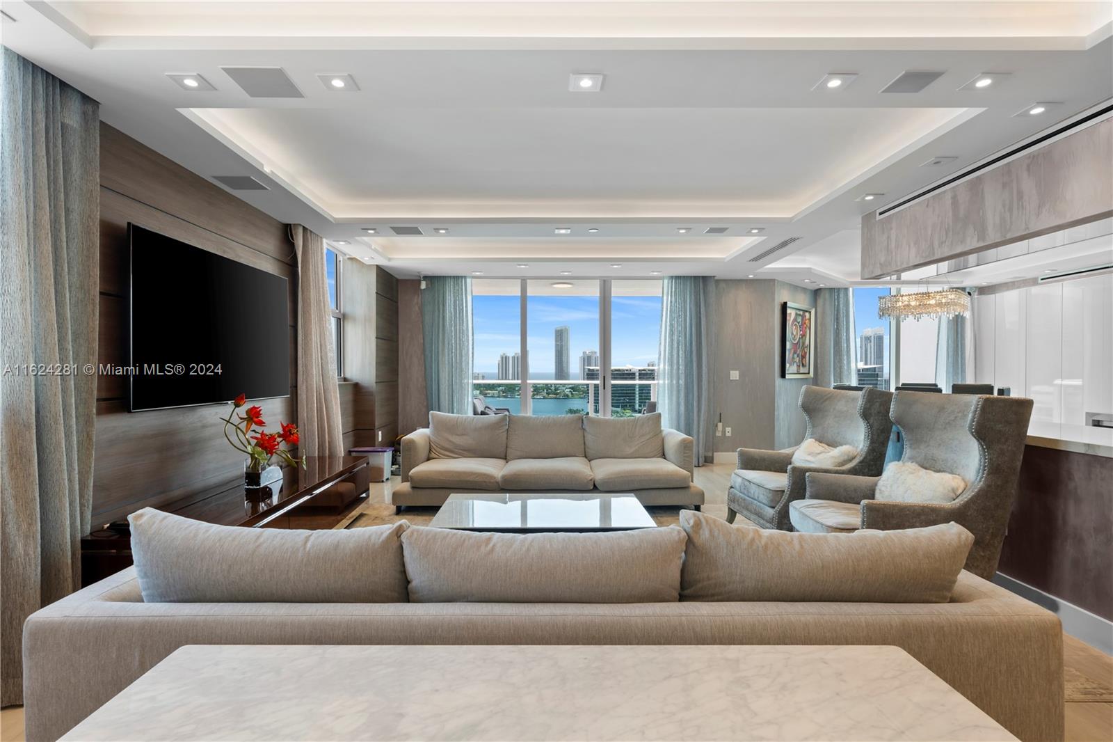 a living room with furniture and a flat screen tv