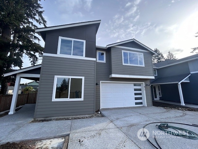 a front view of a house with a garage