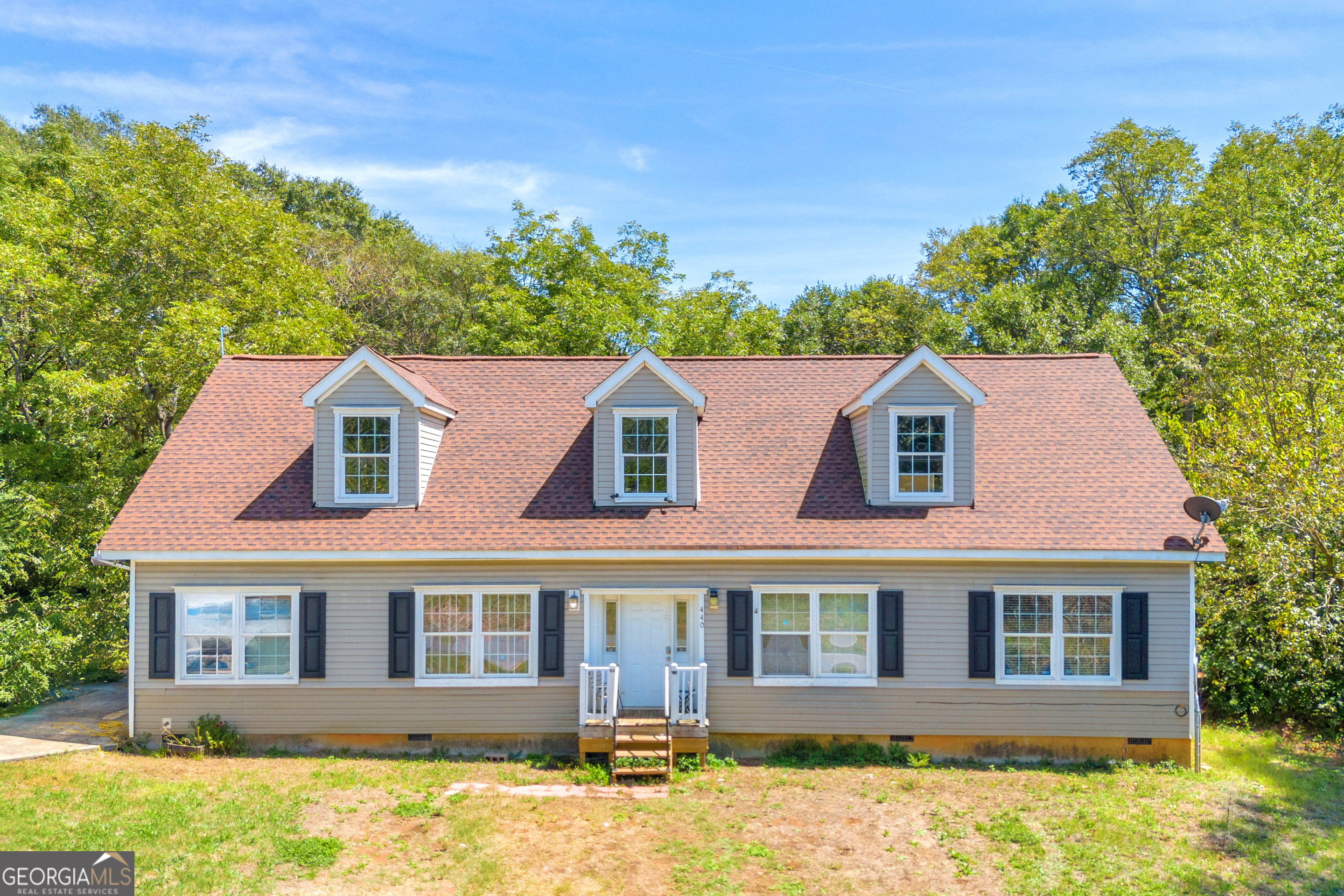 front view of a house with a yard