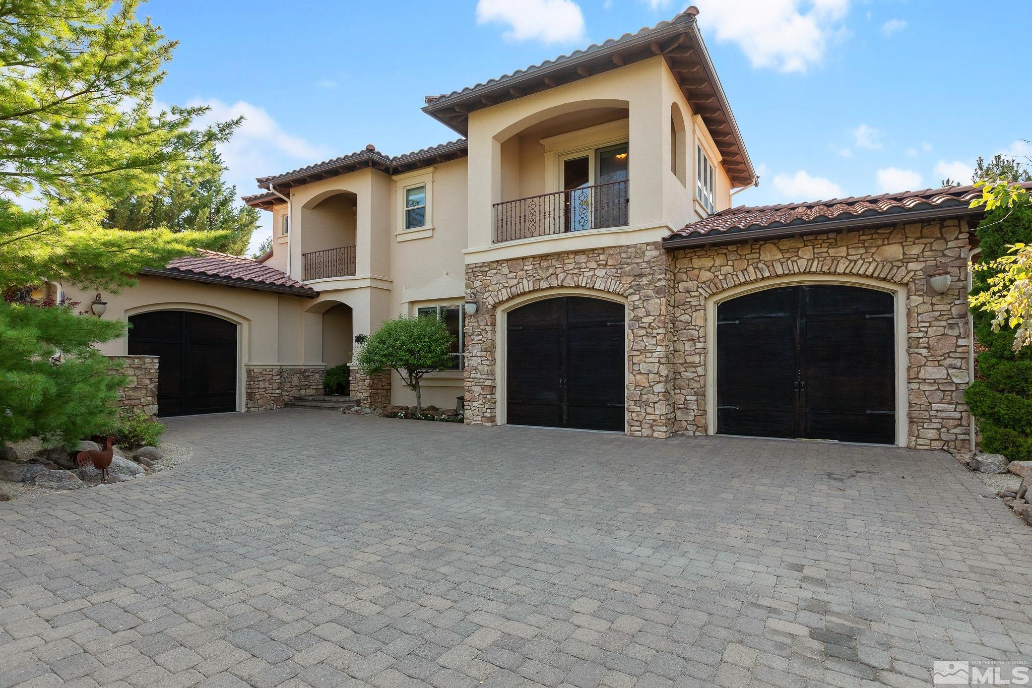 a view of a house with a yard and garage