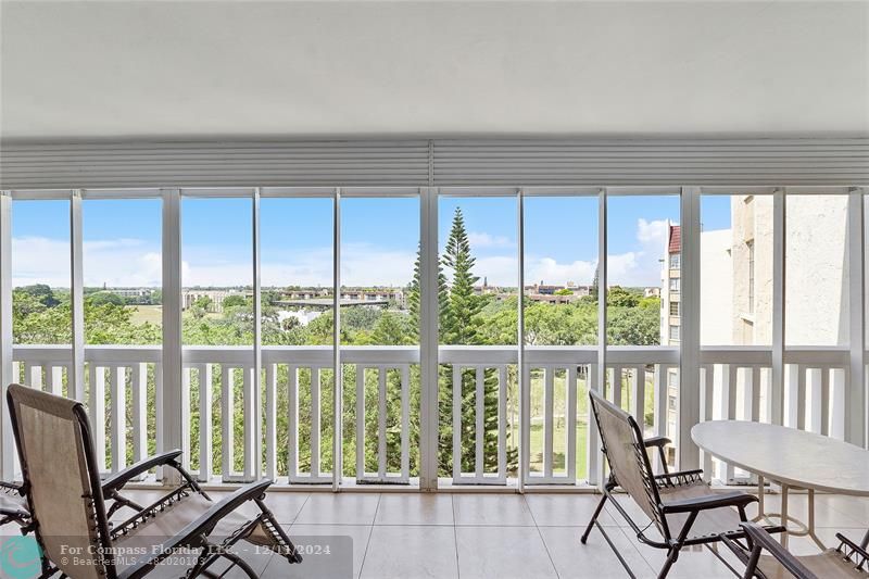 a view of a city from a dining room with large windows