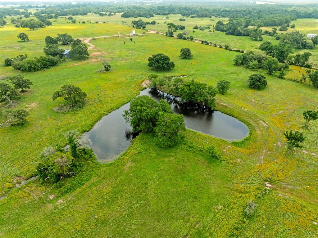 a view of a lake with a yard and lake view