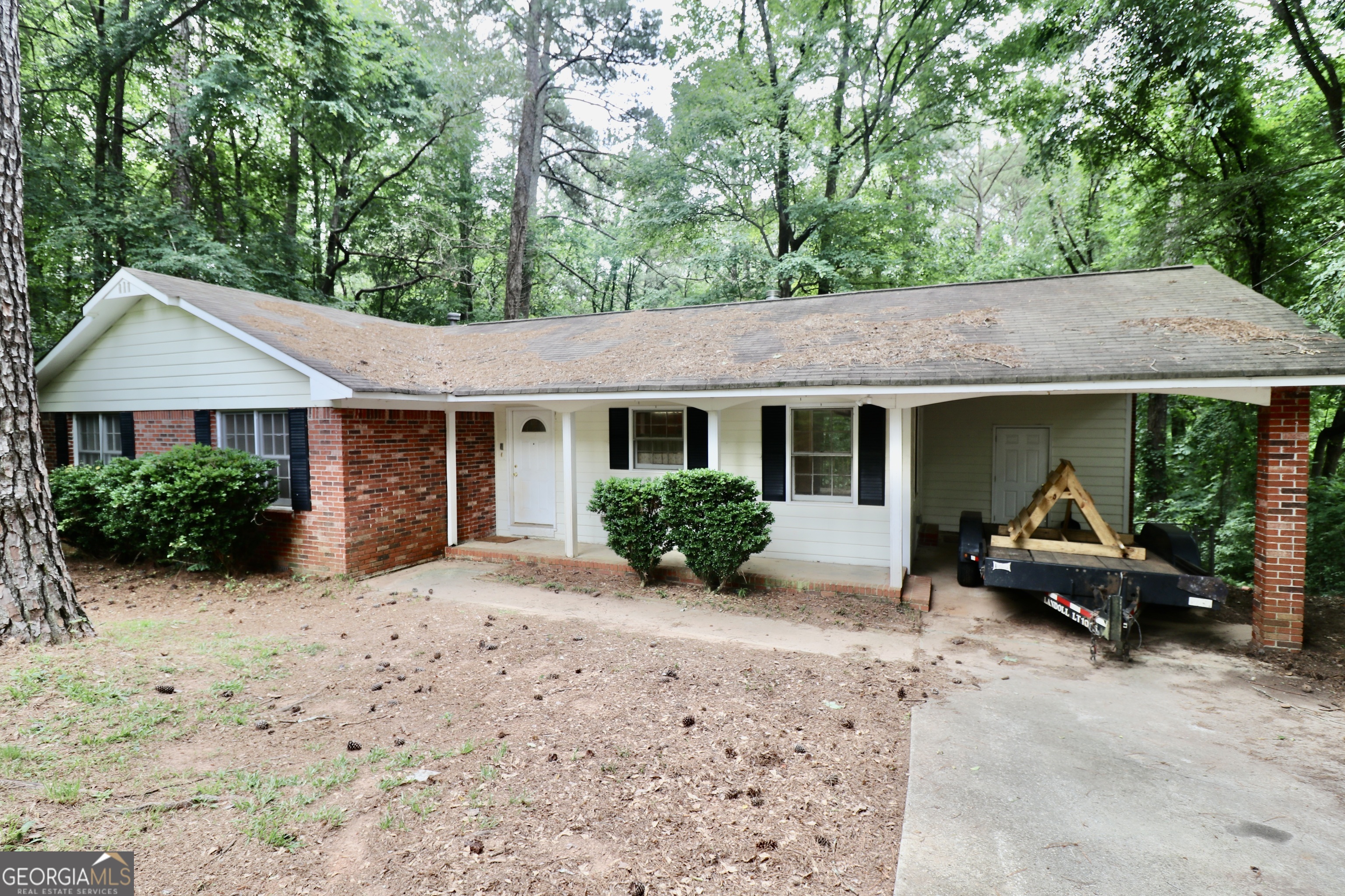 a view of a house with backyard sitting area and porch