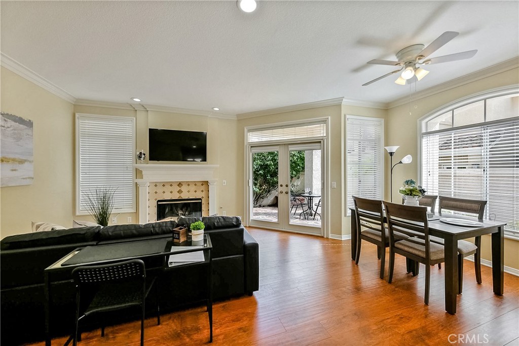 a living room with fireplace furniture and a flat screen tv