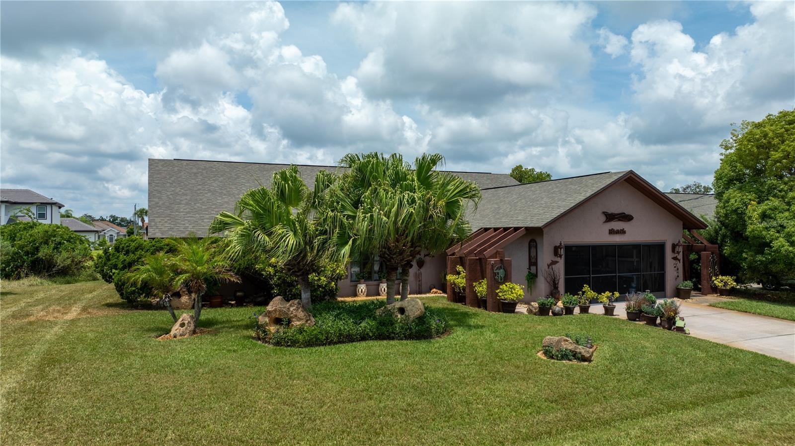 a aerial view of a house with swimming pool and garden