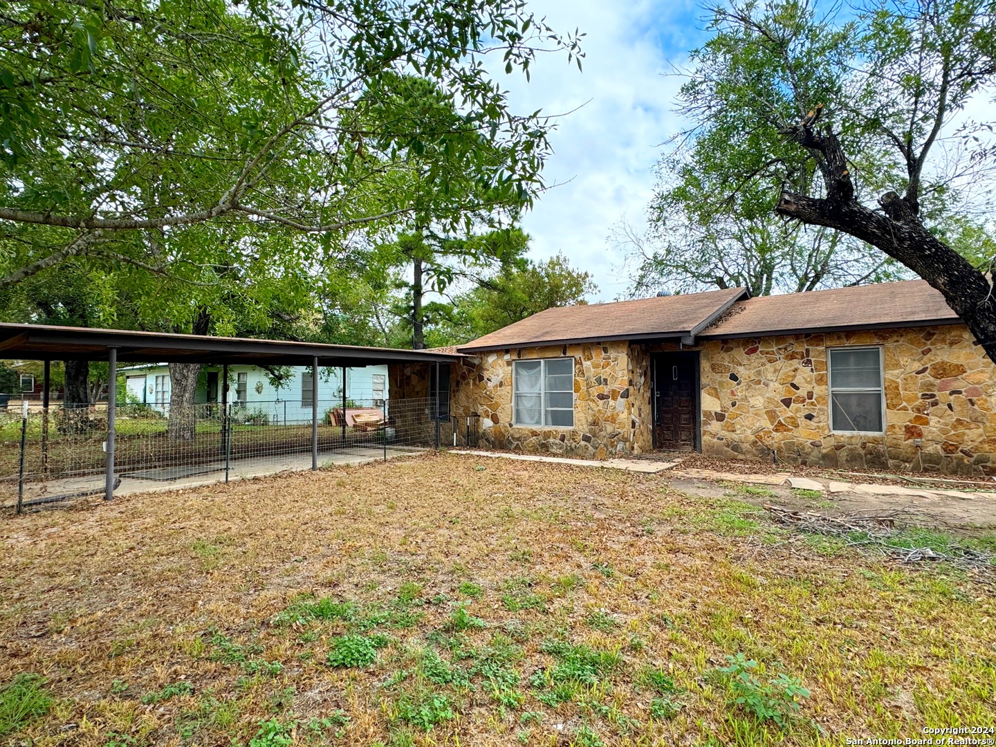 a house with trees in the background