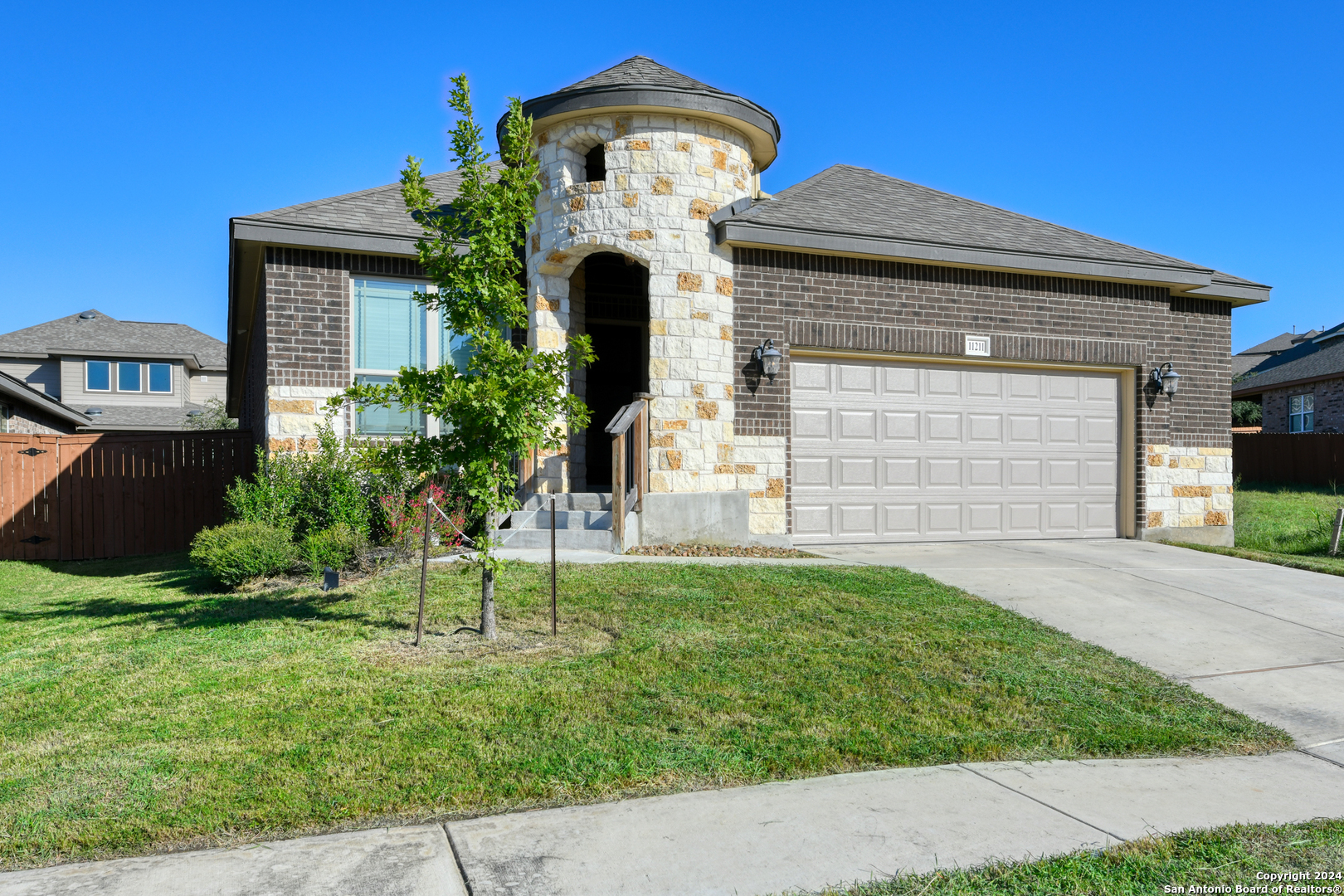 a front view of a house with a yard