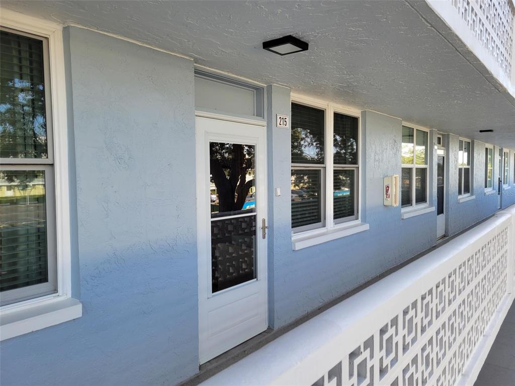 a view of a hallway with windows