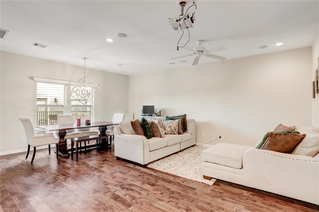 The living and dining areas are versatile, allowing for many living area combinations. This space gets plenty of natural light and features a projector which you can use to eliminate the space for a TV.