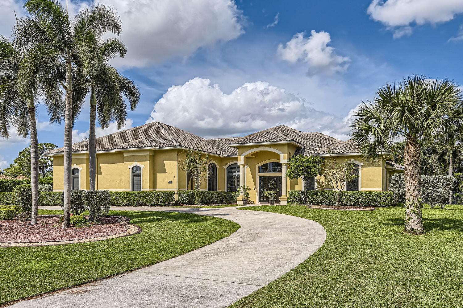 a front view of a house with a yard