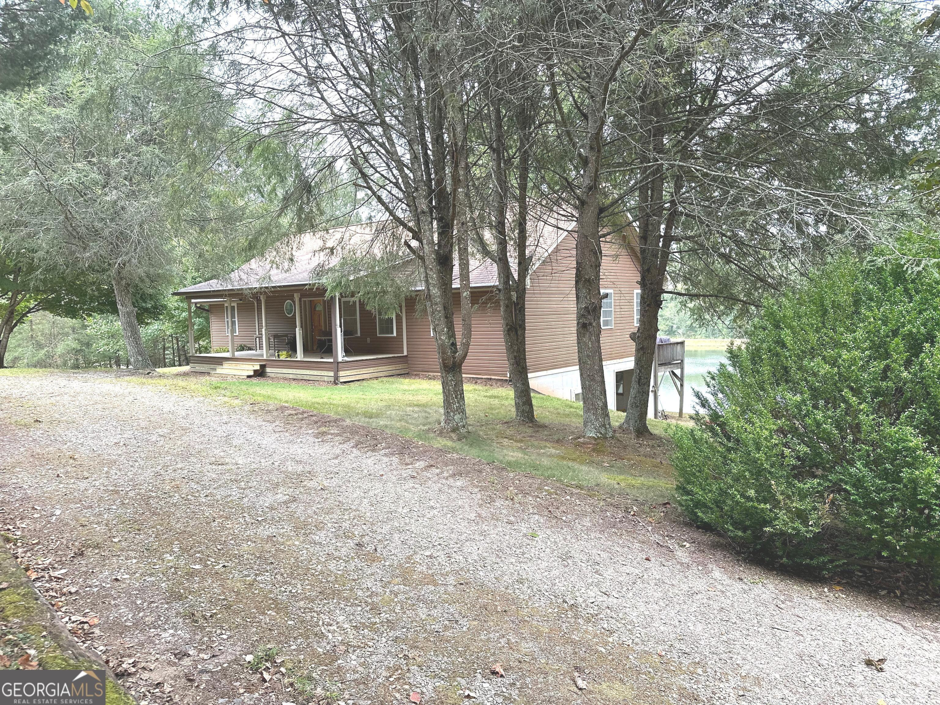 a view of a house with trees in the background