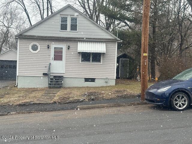 a view of a car parked in front of a house